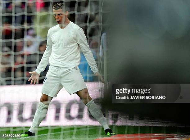 Real Madrid's Portuguese forward Cristiano Ronaldo celebrates the opening goal during the Spanish league football match Real Madrid CF vs Real...