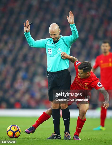 Referee Anthony Taylor stands on the way of Philippe Coutinho of Liverpool during the Premier League match between Liverpool and Sunderland at...