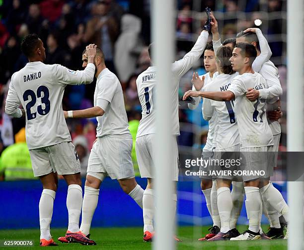 Real Madrid players celebrate the opening goal during the Spanish league football match Real Madrid CF vs Real Sporting de Gijon at the Santiago...