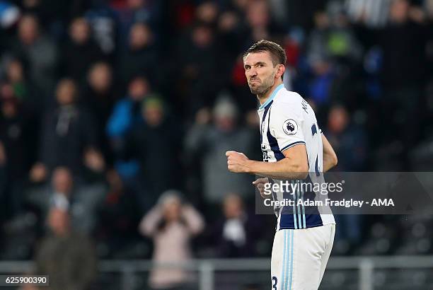 Gareth McAuley of West Bromwich Albion celebrates after scoring a goal to make it 0-1 during the Premier League match between Hull City and West...