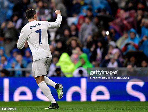 Real Madrid's Portuguese forward Cristiano Ronaldo celebrates his second goal during the Spanish league football match Real Madrid CF vs Real...