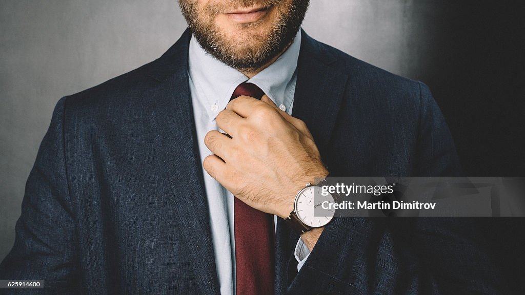 Businessman getting dressed