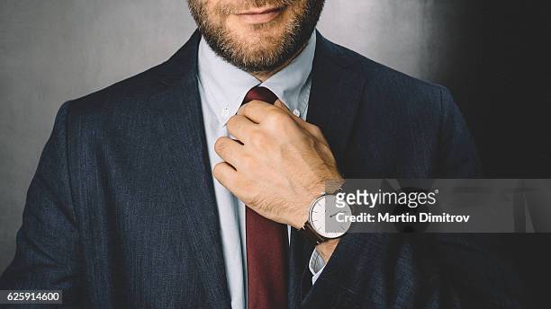 businessman getting dressed - tied up stock pictures, royalty-free photos & images