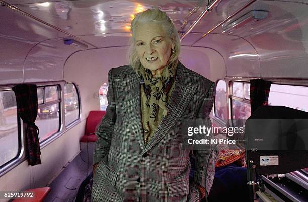 Vivienne Westwood poses on a bus stationed on Chelsea Embankment as her son, Joe Corre burns his entire £5 million punk collection on a nearby boat...