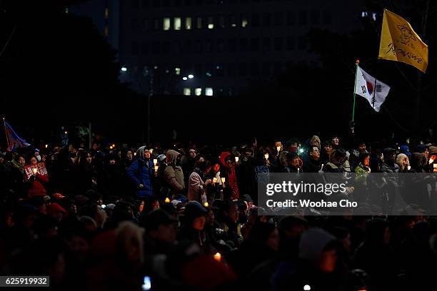 Masses of protesters gathered and occupy major streets in the city center for a rally against South Korean President Park Geun-hye on November 26,...