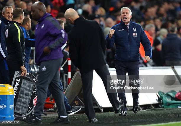 Alan Pardew, Manager of Crystal Palace celebrates his team's third goal during the Premier League match between Swansea City and Crystal Palace at...