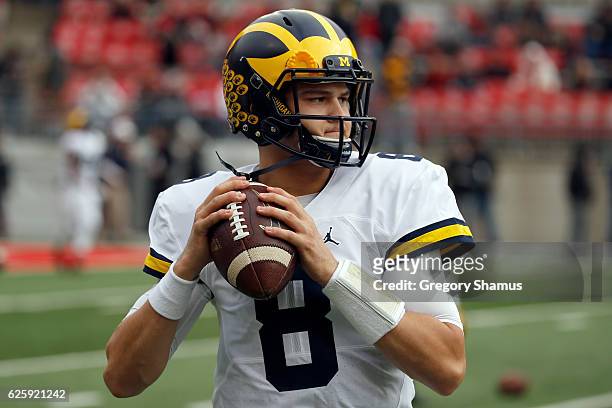 John O'Korn of the Michigan Wolverines warms up on the field prior to the game against the Ohio State Buckeyes at Ohio Stadium on November 26, 2016...