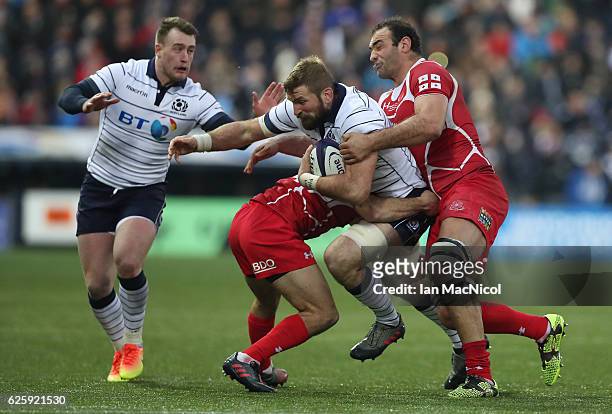 John Barclay of Scotland is tackled by Mamuka Gorgodze of Georgia during the Autumn Test Match between Scotland and Georgia at Rugby Park on November...