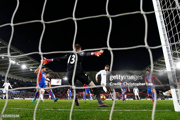 Fernando Llorente of Swansea City scores his team's fifth goal past Wayne Hennessey of Crystal Palace during the Premier League match between Swansea...