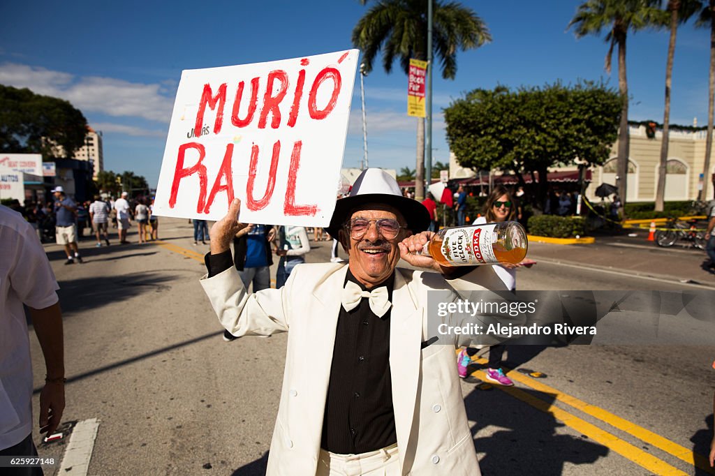 Elderly man holding sign