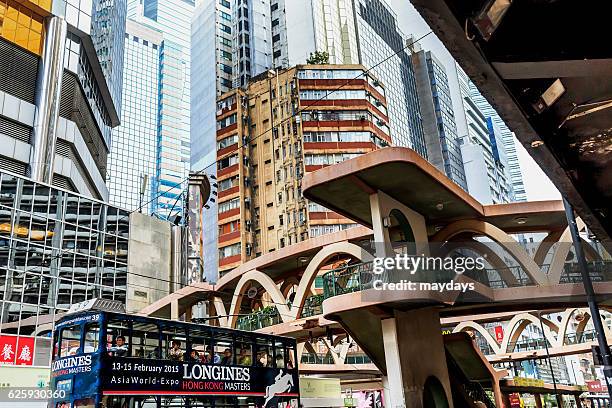 hong kong elevated footpath - packed elevator stock pictures, royalty-free photos & images