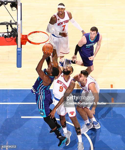 Kyle O'Quinn of the New York Knicks blocks the shot from Marvin Williams of the Charlotte Hornets at Madison Square Garden in New York, New York....