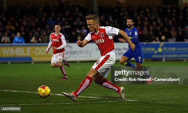 Fleetwood Town's Kyle Dempsey skips past the AFC Wimbledon goalkeeper James Shea but is unable to score during the Sky Bet League One match between...