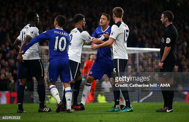 Nemanja Matic of Chelsea and Victor Wanyama of Tottenham Hotspur are kept apart by their team mates as referee Michael Oliver looks on during the...