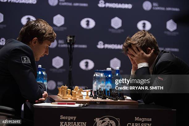 Sergey Karjakin , Russian chess grandmaster, plays against Magnus Carlsen, Norwegian chess grandmaster and current World Chess Champion, during round...