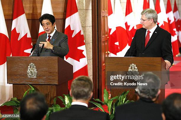 Canada - Japanese Prime Minister Shinzo Abe and Canadian Prime Minister Stephen Harper hold a press conference after their talks in Ottawa on Sept....
