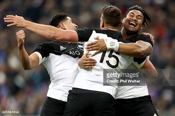 Israel Dagg of the New Zealand All Blacks celebrates his try with Anton Leinert-Brown and Julian Savea during the international rugby match between...