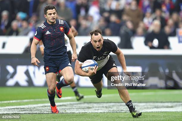 Israel Dagg of the New Zealand All Blacks scores the opening try during the international rugby match between France and New Zealand at Stade de...