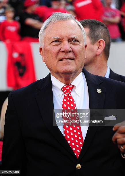 Georgia Governor Nathan Deal watches the action from the field between the Georgia Tech Yellow Jackets and the Georgia Bulldogs at Sanford Stadium on...