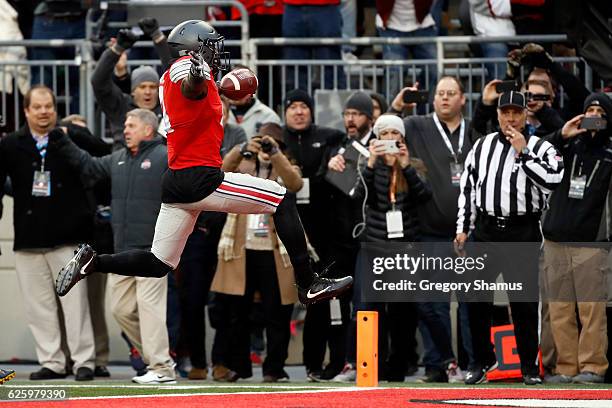 Curtis Samuel of the Ohio State Buckeyes scores the winning touchdown in double overtime against the Michigan Wolverines at Ohio Stadium on November...