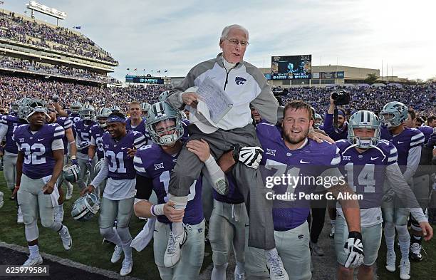 Head coach Bill Snyder of the Kansas State Wildcats gets carried off the field, after winning his 200th career game against the Kansas Jayhawks on...