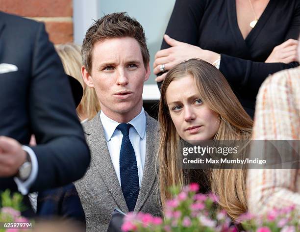 Eddie Redmayne and Hannah Bagshawe watch the racing as they attend the 60th Hennessy Gold Cup at Newbury Racecourse on November 26, 2016 in Newbury,...