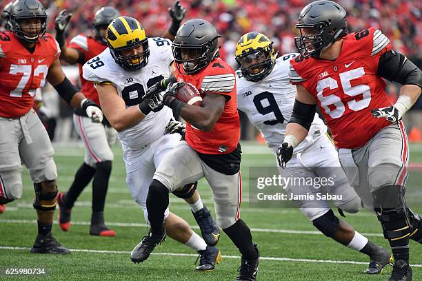 Curtis Samuel of the Ohio State Buckeyes rushes for the game-winning touchdown in overtime against the Michigan Wolverines at Ohio Stadium on...
