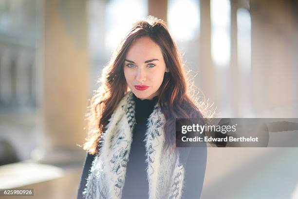 Ophelie Duvillard , is wearing Calzedonia tights, Primark heels shoes, a Claudie Pierlot black dress, a Molly Braken faux fur white sleeveless...