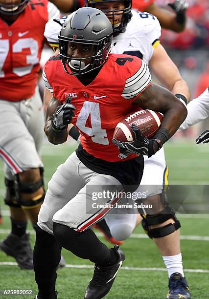 Curtis Samuel of the Ohio State Buckeyes rushes for the game-winning touchdown in overtime against the Michigan Wolverines at Ohio Stadium on...