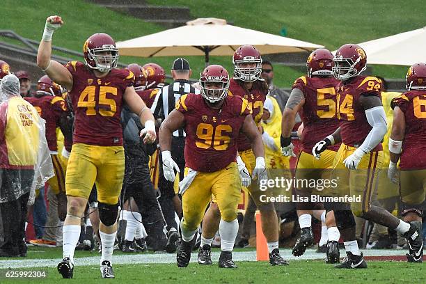 The USC Trojans celebrate after scoring a touchdown in the second quarter against the Notre Dame Fighting Irish at Los Angeles Memorial Coliseum on...