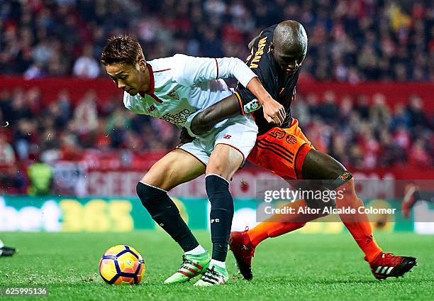 Hiroshi Kiyotake of Sevilla FC competes for the ball with Eliaquim Mangala of Valencia CF during the La Liga match between Sevilla FC and Valencia CF...