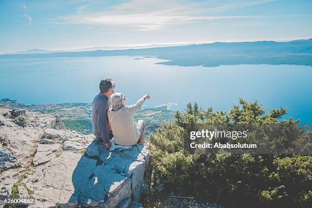 senior caucasian couple on vidova gora, brac, dalmatia, croatia, europe - brac eiland stockfoto's en -beelden