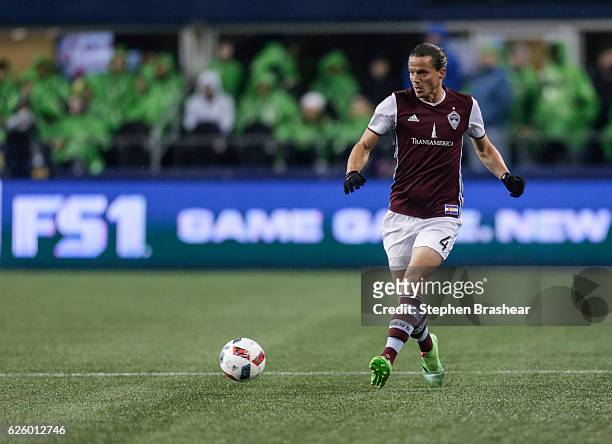 Marc Burch of the Colorado Rapids passes the ball during a match against the Seattle Sounders in the first leg of the Western Conference Finals at...