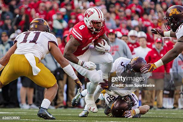 Wisconsin Badgers running back Corey Clement gets tackled by Minnesota Golden Gophers defensive back KiAnte Hardin durning an NCAA Football game...