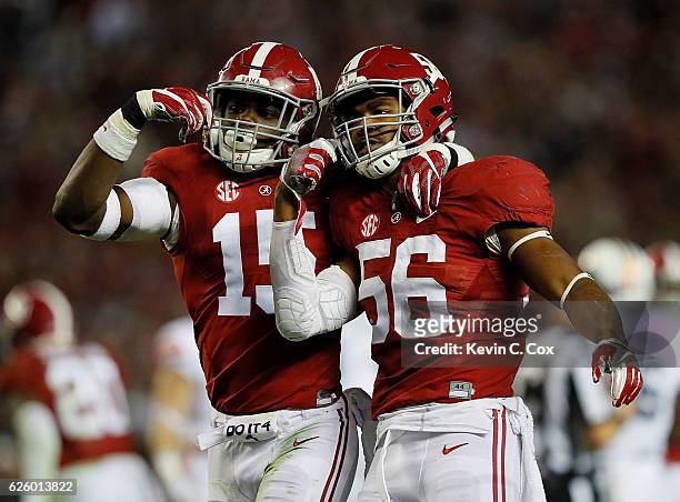 Ronnie Harrison and Tim Williams of the Alabama Crimson Tide react after a defensive stop against the Auburn Tigers at Bryant-Denny Stadium on...