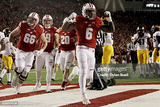 Corey Clement of the Wisconsin Badgers celebrates after scoring a touchdown in the fourth quarter against the Minnesota Golden Gophers at Camp...