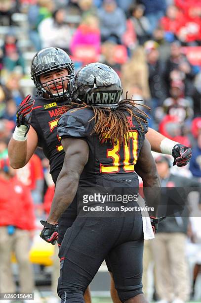 Maryland Terrapins running back Andrew Stefanelli celebrates with running back Kenneth Goins Jr. After 1 yard touchdown run in the third quarter on...