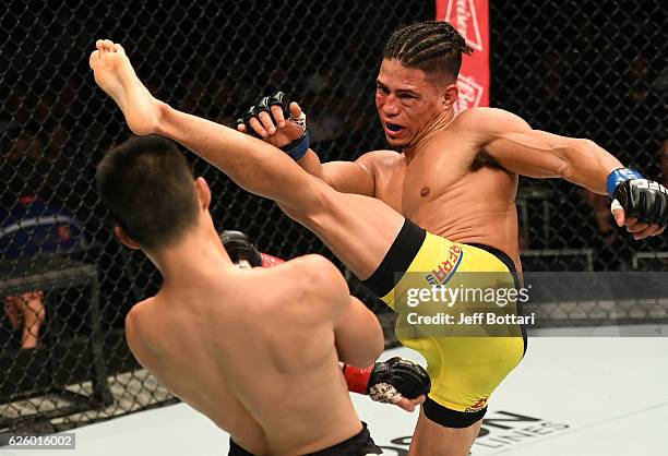 Geane Herrera kicks Ben Nguyen in their flyweight bout during the UFC Fight Night event at Rod Laver Arena on November 27, 2016 in Melbourne,...