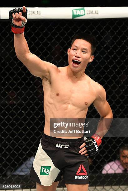 Ben Nguyen celebrates after the conclusion of his flyweight bout against Geane Herrera during the UFC Fight Night event at Rod Laver Arena on...