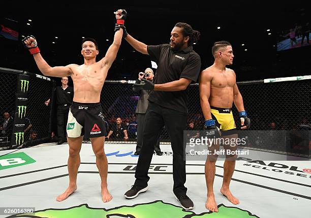 Ben Nguyen celebrates after defeating Geane Herrera in their flyweight bout during the UFC Fight Night event at Rod Laver Arena on November 27, 2016...
