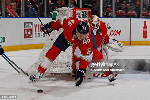 Jakub Kindl clears the puck from in front of goaltender Roberto Luongo of the Florida Panthers during second period action against the Columbus Blue...