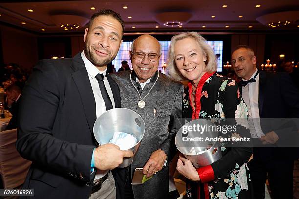 Mike Adler and Princess Ursula zu Hohenlohe sell loose to Anisur Rahman during the charity event dolphin aid gala - 'Dolphin's Night' at...