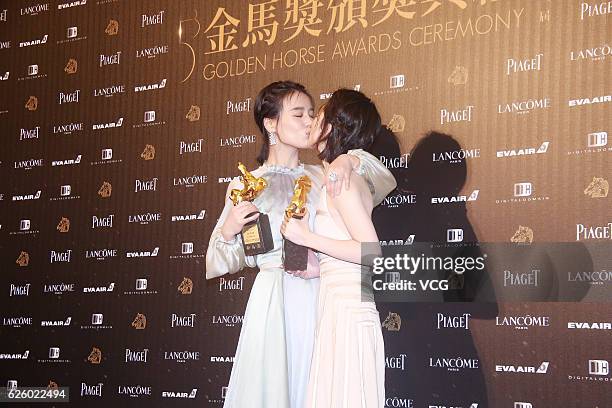 Actress Ma Sichun and actress Zhou Dongyu pose with the trophies of Best Leading Actress during the 53rd Golden Horse Awards Ceremony at Sun Yat-sen...