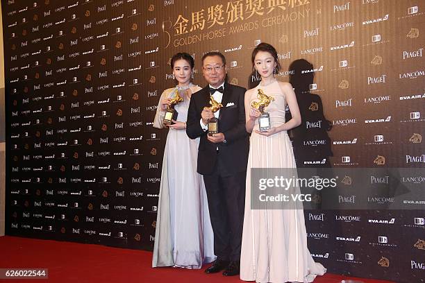 Actress Ma Sichun, actor Fan Wei and actress Zhou Dongyu pose with the trophies of Best Leading Actress and Actor during the 53rd Golden Horse Awards...