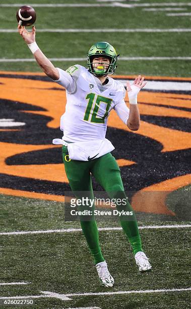 Quarterback Justin Herbert of the Oregon Ducks passes the ball during the fourth quarter of the game against the Oregon State Beavers at Reser...