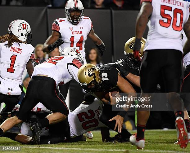 November 26: Colorado Buffaloes quarterback Sefo Liufau makes a second effort and scores a touchdown against the Utah Utes in the first quarter at...