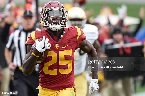 Ronald Jones II of the USC Trojans carries the ball to score a touchdown in the first quarter against the Notre Dame Fighting Irish at Los Angeles...