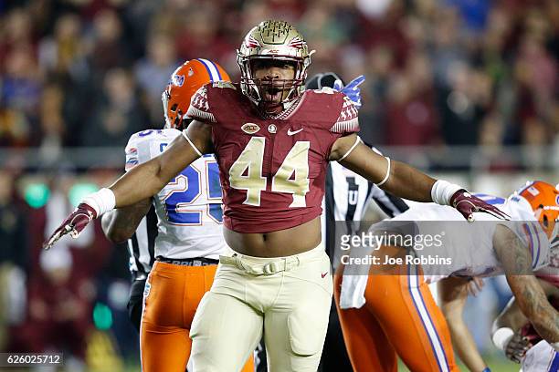 DeMarcus Walker of the Florida State Seminoles reacts after a defensive stop against the Florida Gators in the second quarter of the game at Doak...
