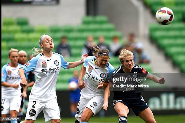 Natasha Dowie of Melbourne Victory and Laura Alleway of Melbourne City attack the ball during the round four A-League match between Melbourne City FC...