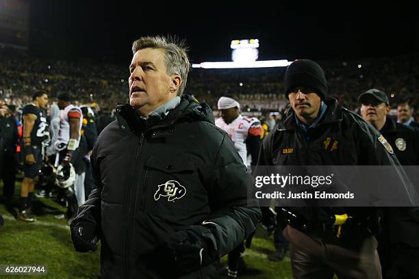 Head Coach Mike MacIntyre of the Colorado Buffaloes runs off the field after defeating the Utah Utes at Folsom Field on November 26, 2016 in Boulder,...